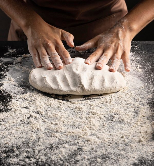 chef-kneading-dough-table_23-2148742165
